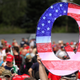 A man holds a “Q” sign, the main emblem of the QAnon conspiracy theory, at a Donald Trump rally in Mohegan Sun Arena in Wilkes Barre, Pennsylvania, in August 2018.